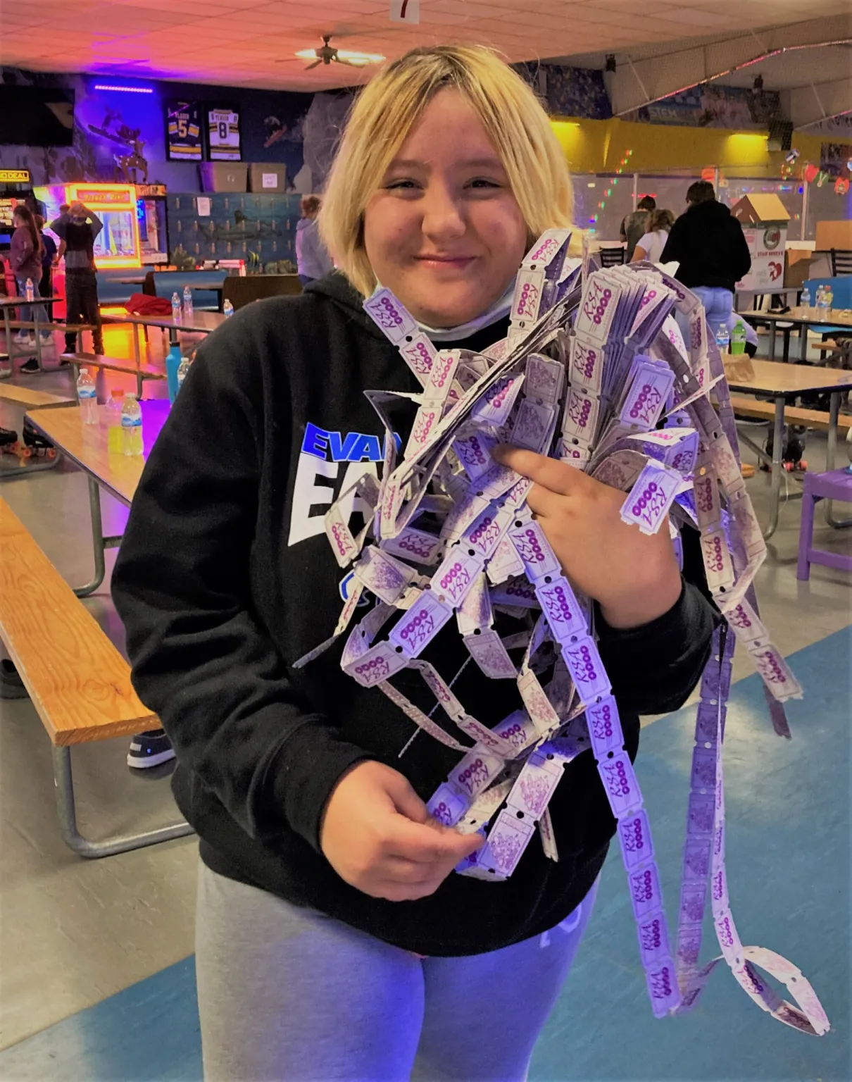 Smiling with a handful of tickets