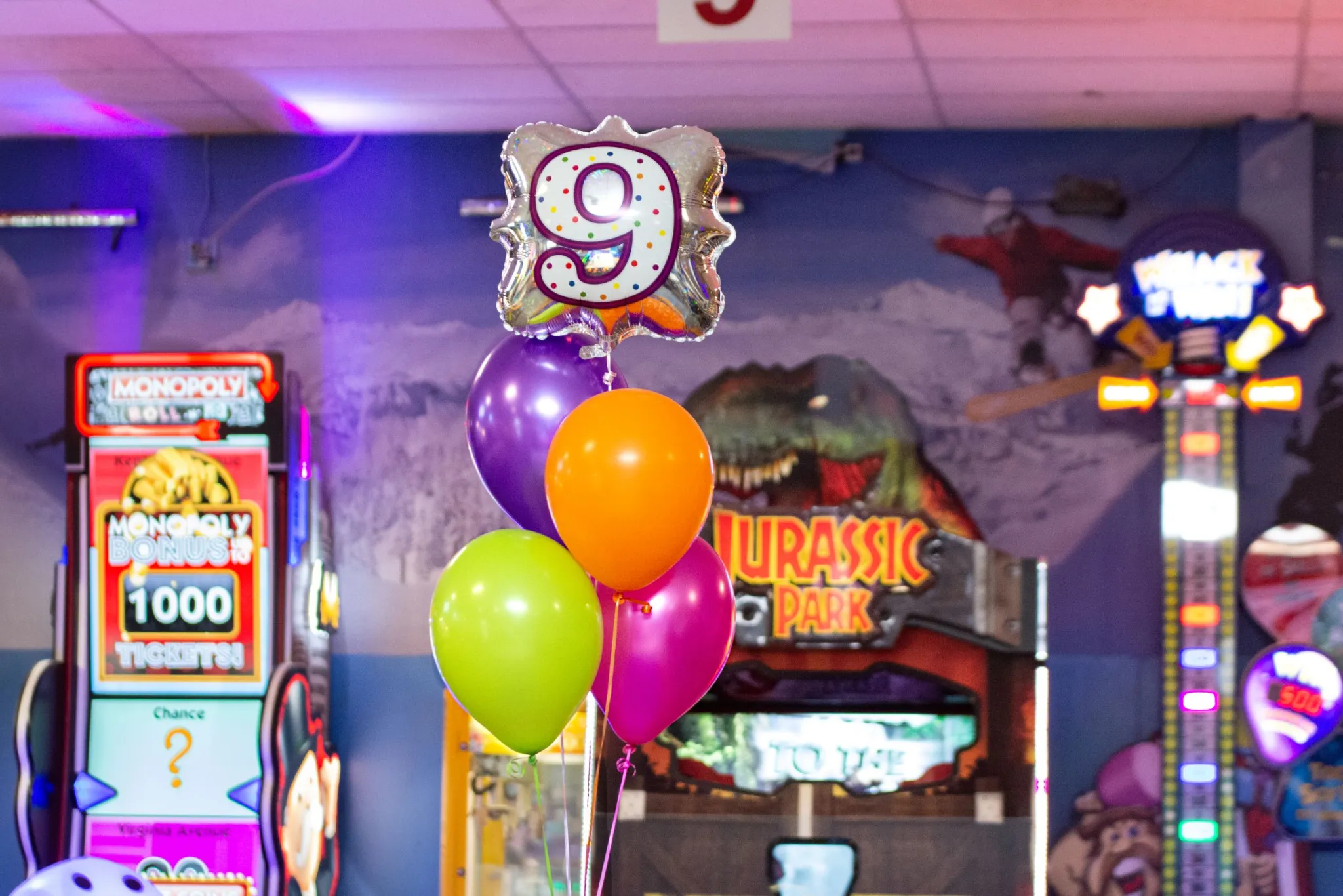 Birthday balloons in vibrant arcade